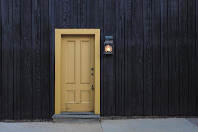 black%20house%20with%20a%20yellow%20wooden%20front%20door black%20house%20with%20a%20yellow%20wooden%20front%20door